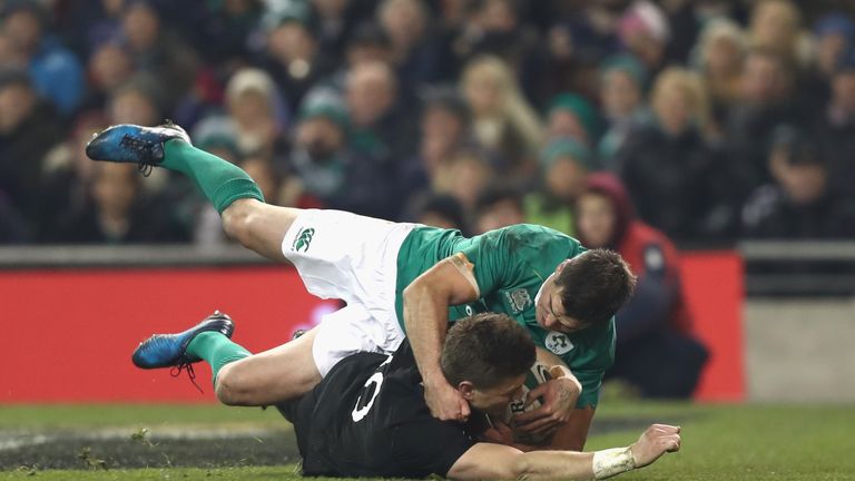 DUBLIN, IRELAND - NOVEMBER 19:  Beauden Barrett of the All Blacks scores a try in the tackle of Johnny Sexton of Ireland during the international rugby mat