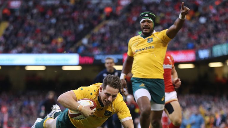 Bernard Foley of Australia dives over to score