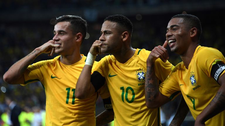 Neymar (C) enjoying his night alongside Philippe Coutinho (L) and Gabriel Jesus against Argentina