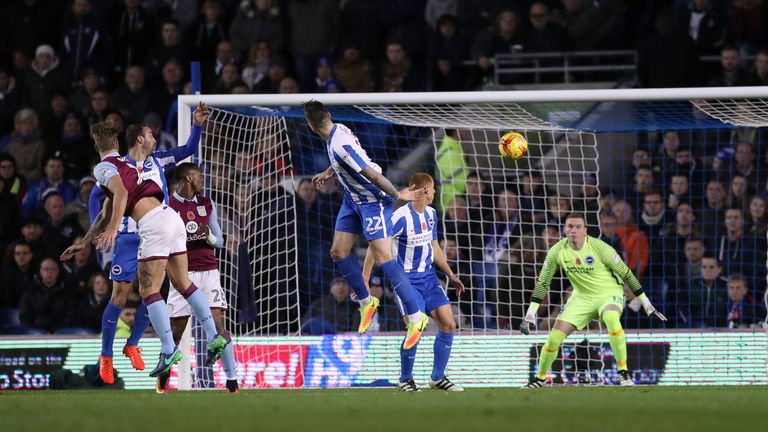 Aston Villa's Nathan Baker (left) scores his side's first goal of the game at Brighton