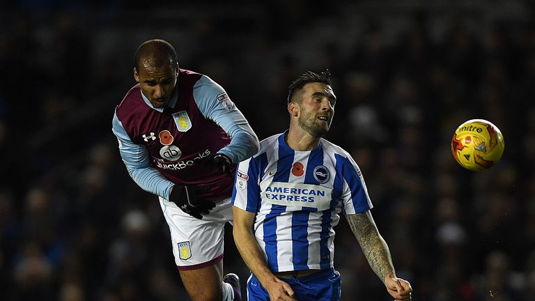 BRIGHTON, ENGLAND - NOVEMBER 18:  Shane Duffy of Brighton is challenged by Gabriel Agbonlahor of Aston Villa during the Sky Bet Championship match between 