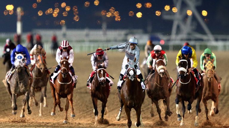 DUBAI, UNITED ARAB EMIRATES - MARCH 26:  California Chrome ridden by  Victor Espinoza wins the Dubai World Cup Sponsored By Emirates Airline as part of the