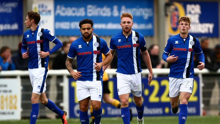 Callum Camps of Rochdale (2nd R) celebrates with his teammates after scoring a last-minute equaliser