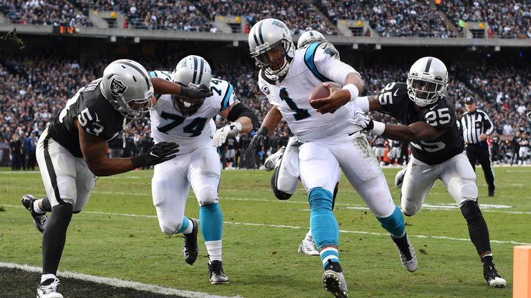 OAKLAND, CA - NOVEMBER 27:  Cam Newton #1 of the Carolina Panthers rushes for a touchdown in the first quarter against the Oakland Raiders during their NFL
