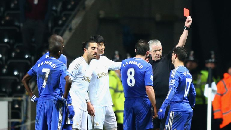 Eden Hazard of Chelsea is sent off by referee Chris Foy