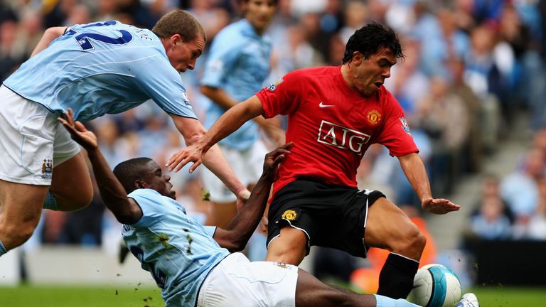 MANCHESTER, UNITED KINGDOM - AUGUST 19:  Micah Richards of Manchester City tackles Carlos Tevez of Manchester United during the Barclays Premiership match 