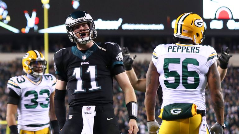 PHILADELPHIA, PA - NOVEMBER 28: Carson Wentz #11 of the Philadelphia Eagles reacts in front of Julius Peppers #56 and Micah Hyde #33 of the Green Bay Packe