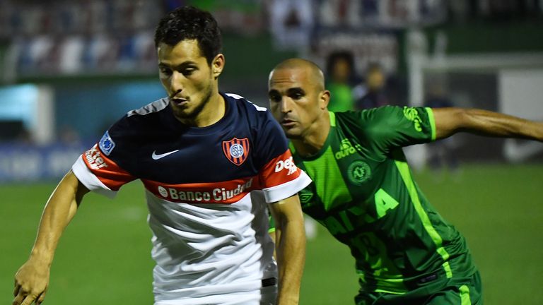 Gil (R) of Brazil's Chapecoense, vies for the ball with Sebastian Blanco (L) of Argentina's San Lorenzo, during their 2016 Copa Sudamericana semifinal seco