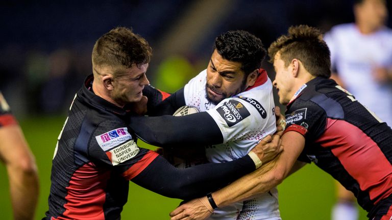 Ulster's Charles Piutau being closely marked by Edinburgh's defence