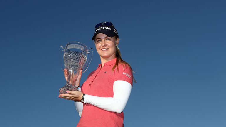 Charley Hull poses with the CME Tour Championship trophy 