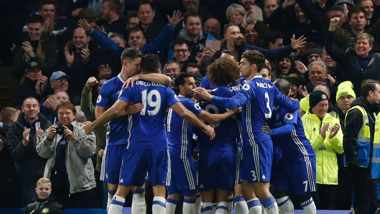 Chelsea players celebrate after Victor Moses scored their second goal against Tottenham