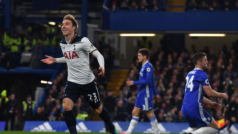 Tottenham Hotspur's midfielder Christian Eriksen (L) celebrates scoring the opening goal against Chelsea