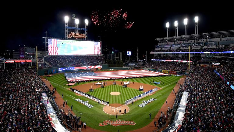 The Cleveland Indians and the Chicago Cubs stands during the national anthem prior to Game One of the 2016 World Series