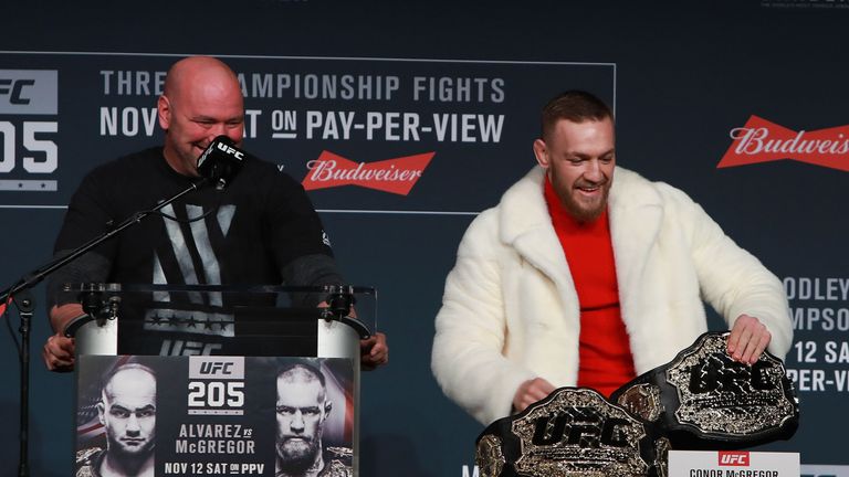 NEW YORK, NY - NOVEMBER 10:  Conor McGregor of Ireland takes Eddie Alvarez's lightweight belt during the UFC 205 press conference at The Theater at Madison