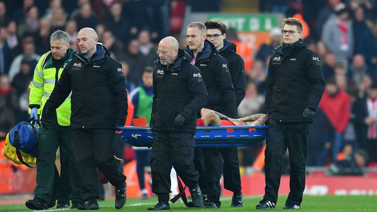 Liverpool's Philippe Coutinho is carried off after being injured