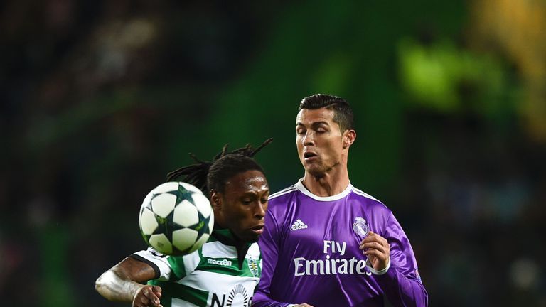 Real Madrid's Portuguese forward Cristiano Ronaldo (R) vies with Sporting's defender Ruben Semedo (L) during the UEFA Champions League football match Sport
