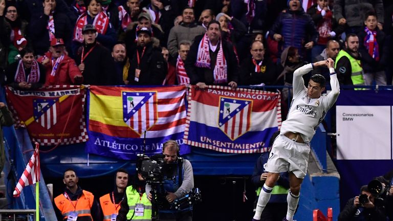 Real Madrid's Portuguese forward Cristiano Ronaldo celebrates a goal during the Spanish league football match between Club Atletico de Madrid and Real Madr