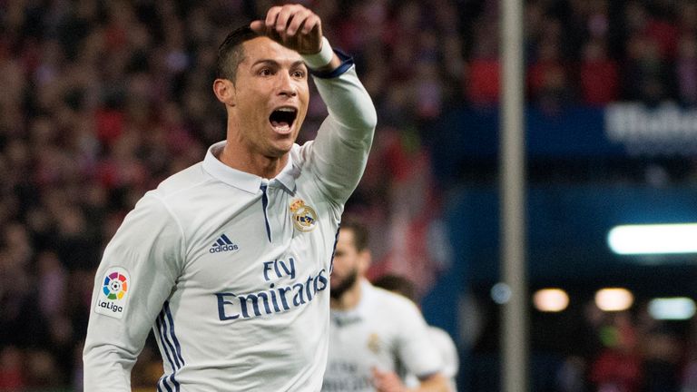 Real Madrid's Portuguese forward Cristiano Ronaldo celebrates after scoring during the Spanish league football match Club Atletico de Madrid vs Real Madrid