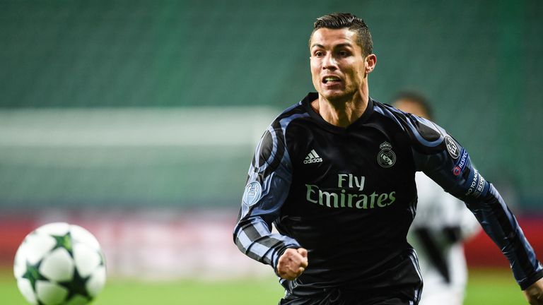 Cristiano Ronaldo chases the ball during the Champions League match against Legia Warsaw 