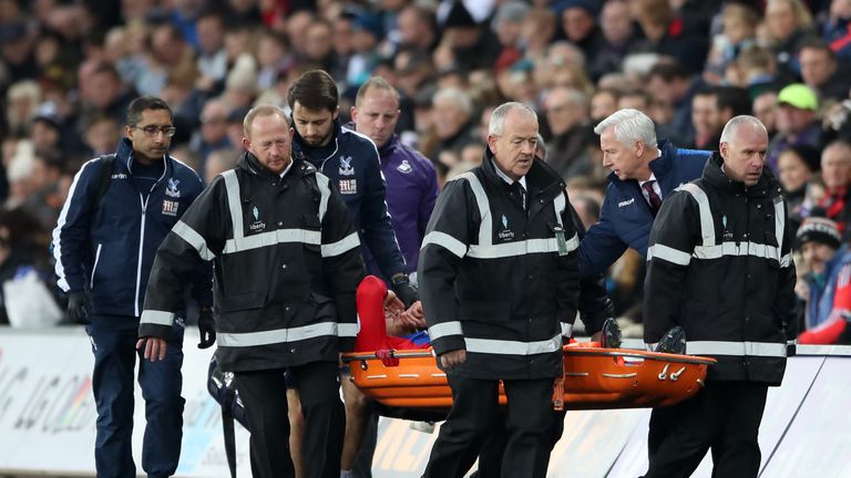 Crystal Palace's Connor Wickham is stretchered off injured
