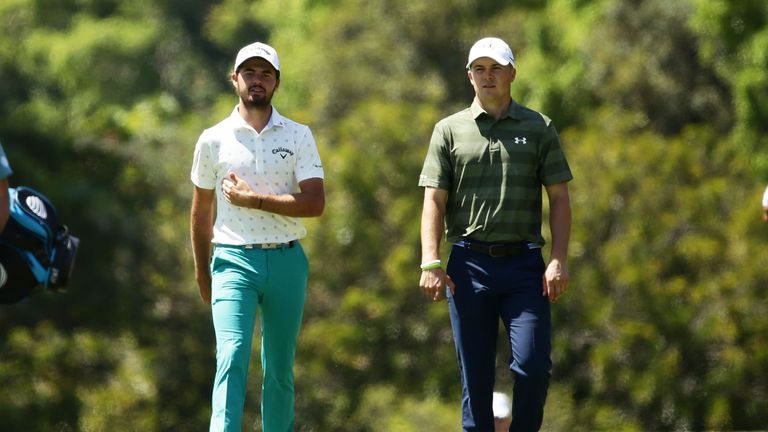 Curtis Luck of Australia (L) walks with Jordan Spieth of the United States (R) down the 7th fairway during day one of the Australian Open