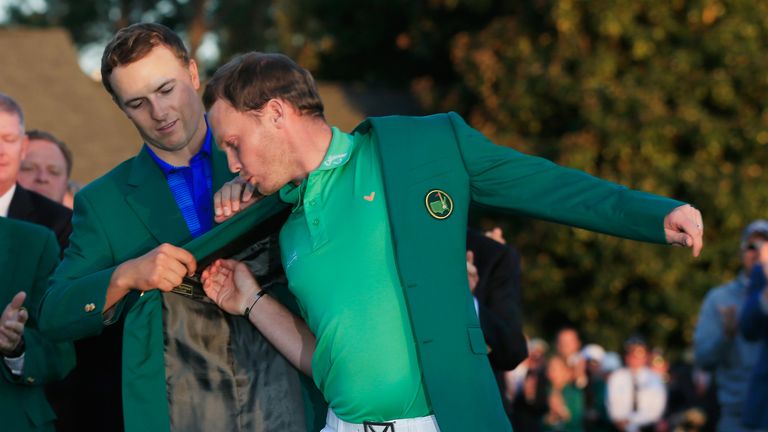 AUGUSTA, GA - APRIL 10:  Danny Willett of England celebrates his victory as Jordan Spieth presents him the winner's green jacket after the final round of t
