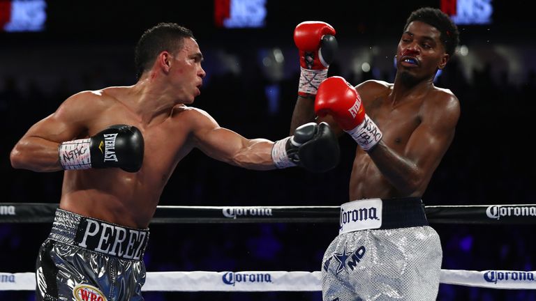 Darleys Perez of Colombia lands a left to the head of opponent Maurice Hooker