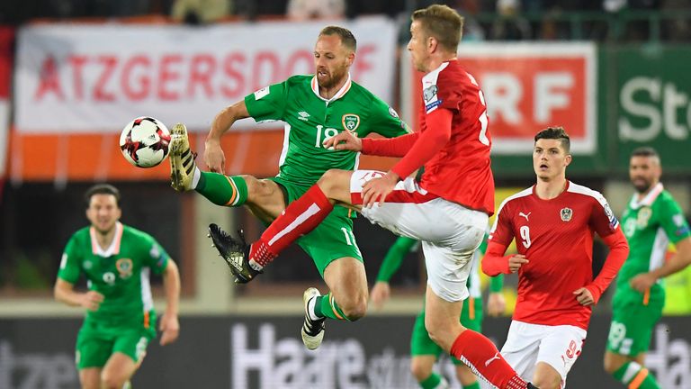 Austria's Marc Janko (R) and Ireland's David Mayler vie for the ball