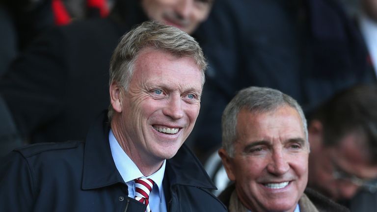 David Moyes, Manager of Sunderland (L) and Graeme Souness (R) both smile while they watch the game from the stands.