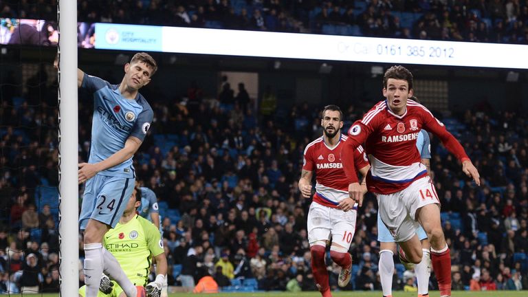 Middlesbrough's Dutch midfielder Marten de Roon (R) wheels away to celebrate after scoring a late equalising goal for 1-1 as Manchester City's English defe