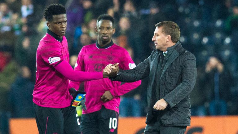 Brendan Rodgers shakes hands with Dedryck Boyata as Moussa Dembele looks on at Rugby Park