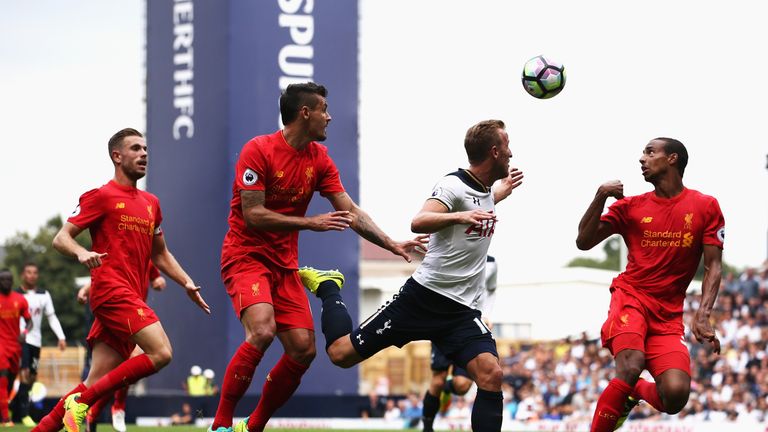 Dejan Lovren and Joel Matip defend against Harry Kane during Tottenham v Liverpool