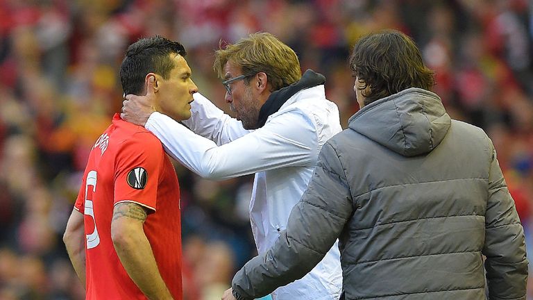 Liverpool's German manager Jurgen Klopp (2nd L) speaks with Liverpool's Croatian defender Dejan Lovren (L) during the UEFA Europa League semi-final second 