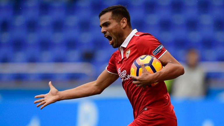 Sevilla's Argentinian defender Gabriel Mercado celebrates his teammate forward Vitolo's goal during the Spanish league football match between RC Deportivo 