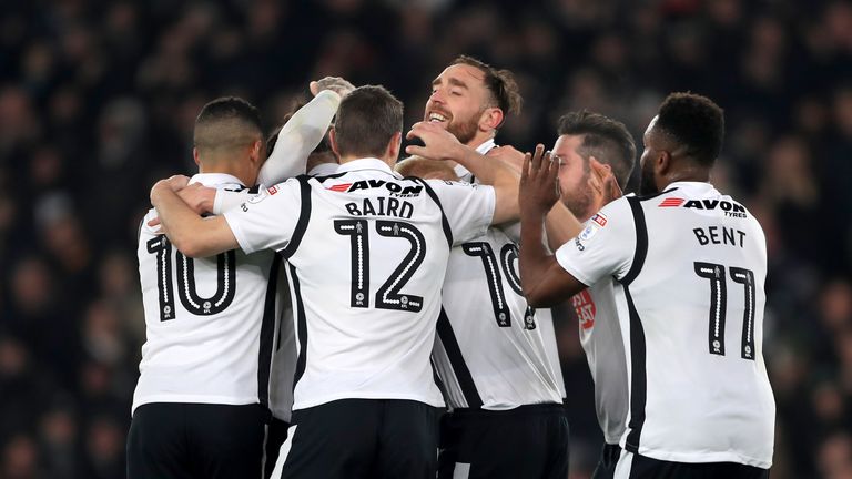 Derby County's Bradley Johnson is mobbed by teammates 