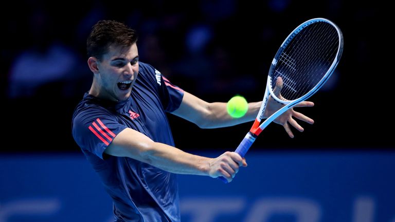 Dominic Thiem of Austria hits a backhand during his men's singles match against Novak Djokovic of Serbia on day one of the ATP World Tour Finals
