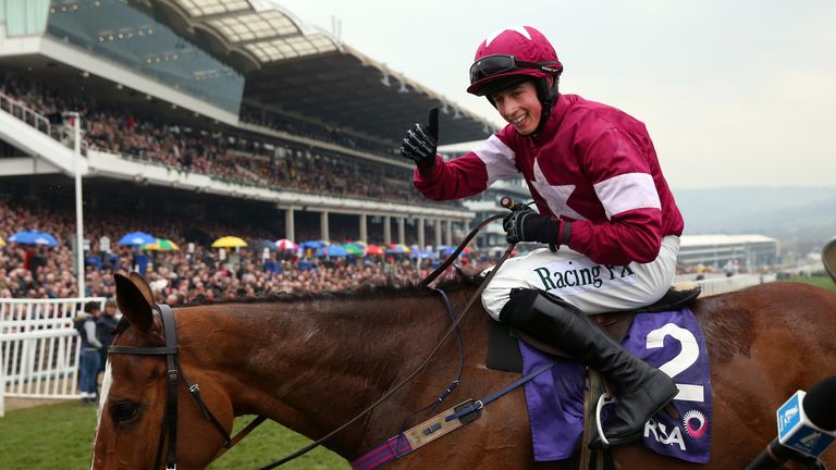 Bryan J. Cooper celebrates on Don Poli after they win the RSA Chase
