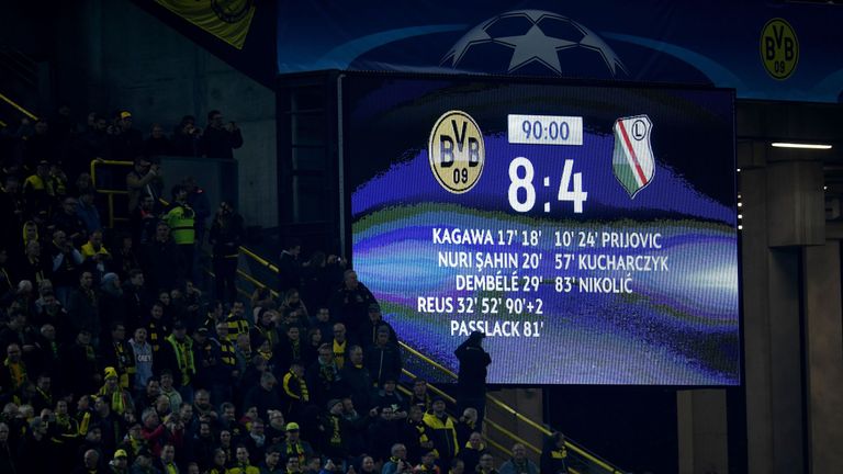 The picture shows the stadium display with the final score of 8-4 between Borussia Dortmund and Legia  Warsaw