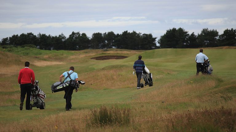 DUNDONALD, SCOTLAND - JULY 28:  Golfers walk down the 5th green during the Virgin Atlantic PGA National Pro-Am Championship Regional Final at Dundonald Lin