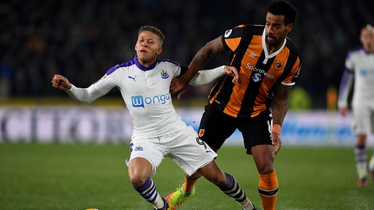 Dwight Gayle is challenged by Tom Huddlestone