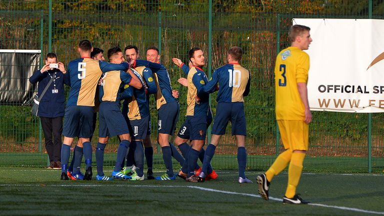 EAST KILBRIDE, SCOTLAND - NOVEMBER 05: East Kilbride players celebrate their first goal of the game by Declan Hughes during  Ferrari Packaging Lowland Leag