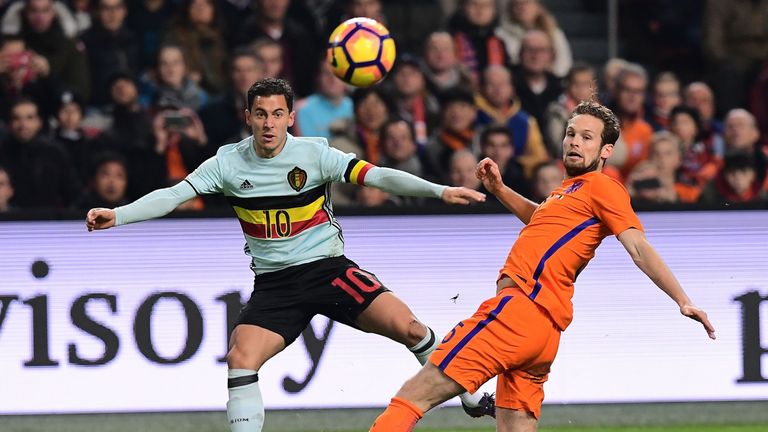 Belgium's forward (L) Eden Hazard and Netherlands' midfielder Daley Blind eye the ball during a friendly football match between The Netherlands and Belgium