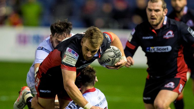 Edinburgh's Tom Brown is on the charge for the hosts