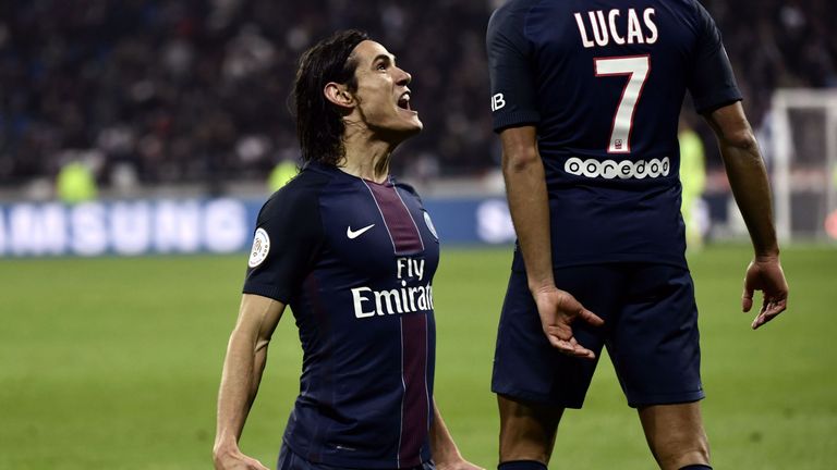 Paris Saint-Germain's Edinson Cavani celebrates with  Lucas Moura