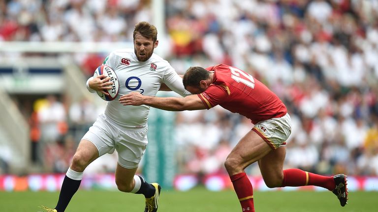 Elliot Daly hands off Jamie Roberts during the Old Mutual Wealth Cup match at Twickenham