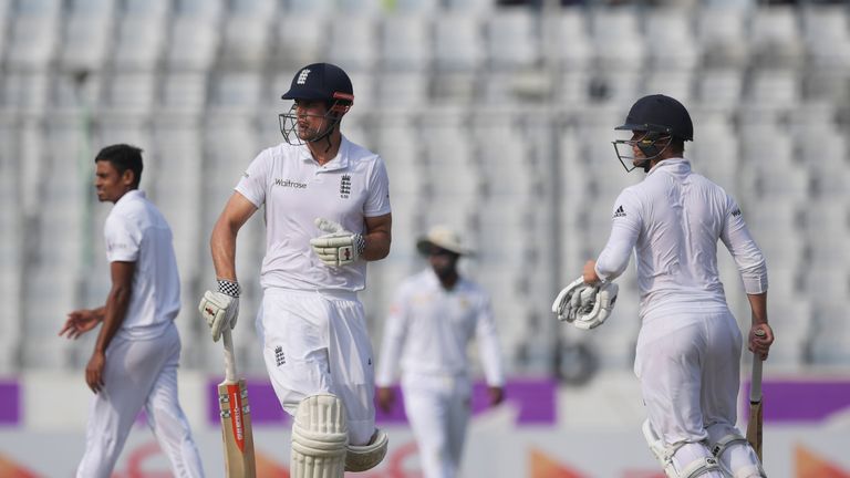 England's captain Alastair Cook (L) and Ben Duckett run between wickets during the third day of the second Test  match between Bangladesh and England 