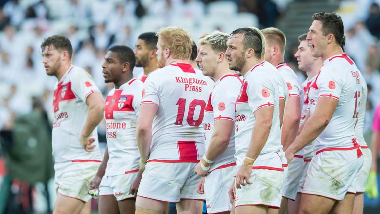 England look on dejected as Australia score another try.