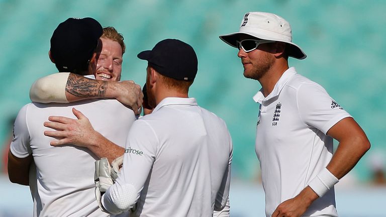 England's players celebrate the wicket of Indian batsman Cheteshwar Pujara