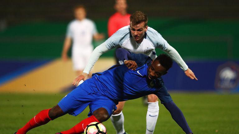 PARIS, FRANCE - NOVEMBER 14:  Moussa Dembele of France U21 battles with Rob Holding of England U21 during the U21 international friendly match between Fran