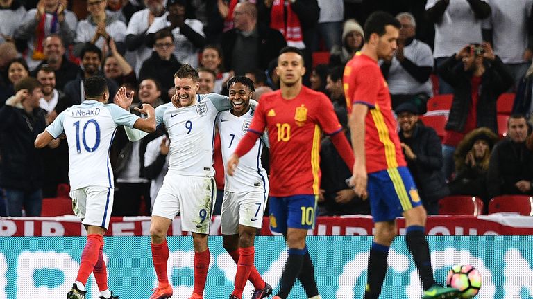 England's striker Jamie Vardy (2L) celebrates scoring his team's second goal during the friendly international football match between England and Spain 